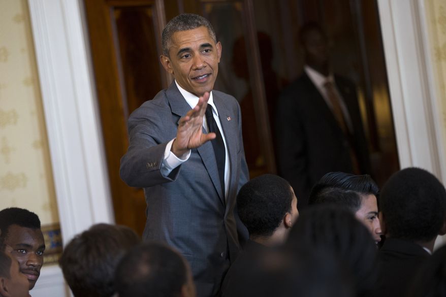 President Barack Obama waves after speaking at a White House mentorship and leadership graduation ceremony , Monday, June 15, 2015, in the Blue Room of the White House in Washington (AP Photo/Evan Vucci)