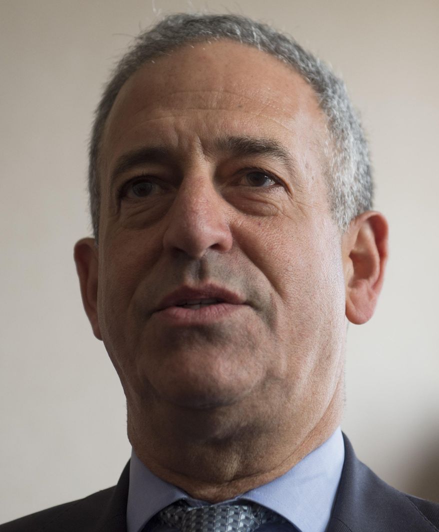 FILE - In a May 4, 2014, file photo, Russ Feingold, U.S. Special Envoy for the Great Lakes Region of Africa and the Democratic Republic of Congo, speaks during a press briefing at the Palais de la Nation in Kinshasa, Democratic Republic of Congo. The political action committee founded by former U.S. Sen. Russ Feingold spent most of its money on fundraising and only gave 5 percent of its income to federal candidates and political parties, based on data compiled by OpenSecrets.org released on Monday, June 15, 2015. Feingold, a longtime champion of campaign finance reform, is running for the Senate against Republican Sen. Ron Johnson who knocked him out of office in 2010. (AP Photo/Saul Loeb, Pool. File)