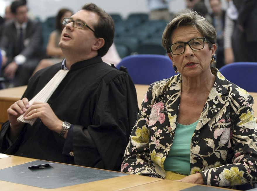 FILE - In this June 5, 2015 file photo, Viviane Lambert, mother of Vincent Lambert, a Frenchman who has been comatose for seven years, attends with her lawyer Jerome Triomphe a verdict about her son in the European Court of Human Rights in Strasbourg, eastern France. France's debate over end-of-life care goes to the Senate, with a bill that would allow doctors to keep terminally ill patients sedated until death comes, but stops short of legalizing euthanasia and assisted suicide. (AP Photo/Christian Lutz, File)
