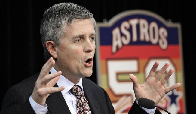 FILE - In this Dec. 8, 2011, file photo, Houston Astros general manager Jeff Luhnow answers a question during a baseball news conference in Houston. The Cardinals have become a model of success by mixing traditional scouting with a heavy dose of analytics, an approach that grew as Jeff Luhnow rose to power in the front office a decade ago. Luhnow took that skill to the Astros, whose player database was allegedly hacked by his former colleagues in St. Louis.  (AP Photo/David J. Phillip, File)