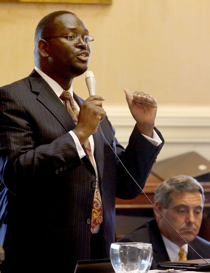 In this June 3, 2014 photo, state Sen. Clementa Pinckney speaks at the South Carolina Statehouse in Columbia, S.C. Pinckney was killed, Wednesday, June 17, 2015, in a shooting at an historic black church in Charleston, S.C. The shooter is still at large. (Grace Beahm/The Post and Courier via AP)