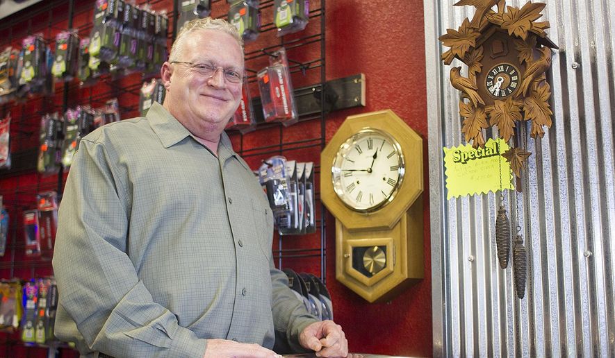 Jerry Green is the owner of The Clock Doc clock repair at the American Audio store in the Powder Basin Shopping Center in Gillette, Wyo. (Tim Goessman/Gillette News Record via AP)