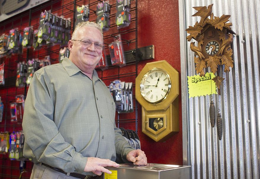 Jerry Green is the owner of The Clock Doc clock repair at the American Audio store in the Powder Basin Shopping Center in Gillette, Wyo. (Tim Goessman/Gillette News Record via AP)