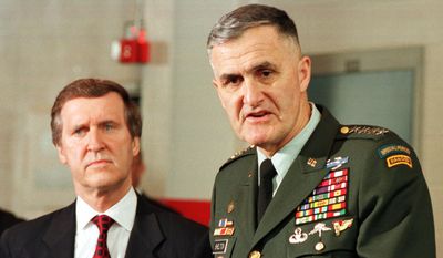 Joint Chiefs Chairman, Gen. Hugh Shelton, right, gestures as Sec. of Defense, William Cohen, brief the press at the Norfolk Naval Base in Norfolk, Va., Thursday April 1, 1999.   (AP Photo/Steve Helber)
