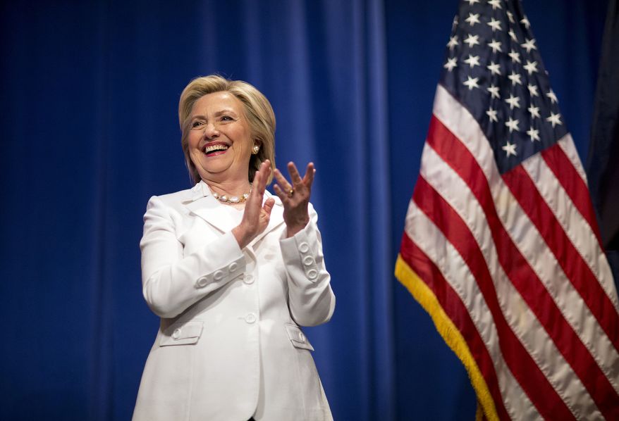 Democratic presidential candidate Hillary Rodham Clinton steps onstage to address an audience at Trident Technical College during a campaign stop Wednesday, June 17, 2015, in North Charleston, S.C. (AP Photo/David Goldman)