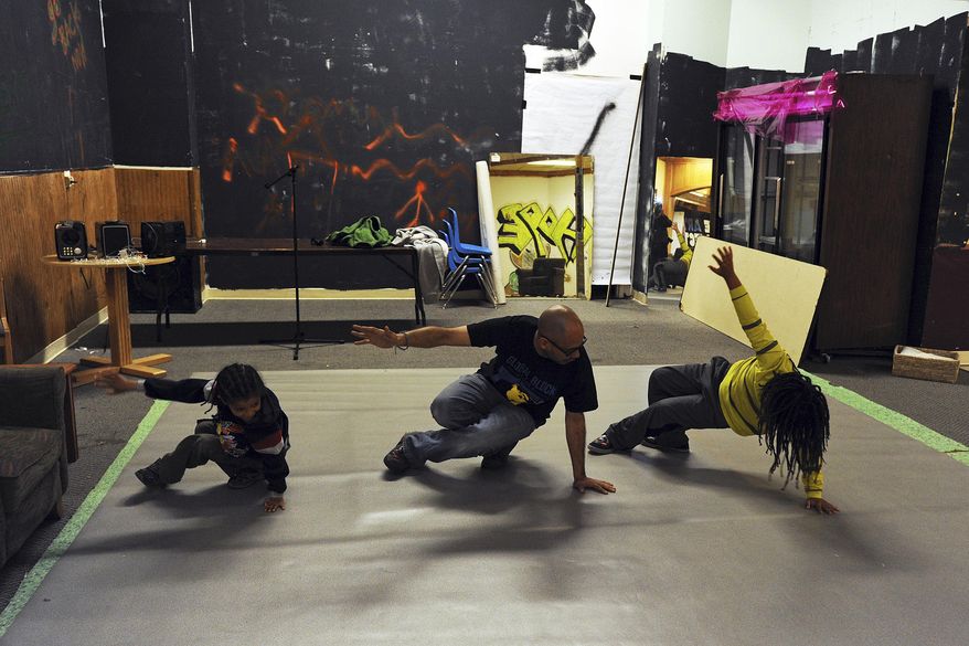 ADVANCE FOR SATURDAY JUNE 20, 2015 AND THEREAFTER In this photo taken June 5, 2015, George Martinez, center, teaches the six step, a series of foundational moves for breakdancing, at his space in a mall in Anchorage, Alaska. Until recently, this mall space was empty, stacked up with old furniture and used as a haunted house at Halloween. This summer, Martinez wants to transform it into something Anchorage doesn’t have: A center for urban arts education and hip-hop culture. (Erik Hill/Alaska Dispatch News via AP)