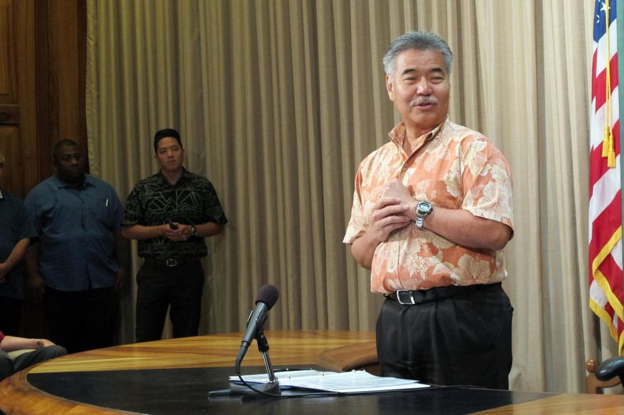 Hawaii Gov. David Ige talks about raising the smoking age on Friday, June 19, 2015, in Honolulu. Ige signed a bill into law that made Hawaii the first state in the nation to raise the legal smoking age to 21. (AP Photo/Cathy Bussewitz)
