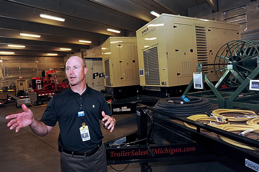 ADVANCE FOR FOR THE WEEKEND OF JUNE 20-21 AND THEREAFTER - In a June 3, 2015 photo, Shane Lies, engineering vice president at the Donald C. Cook Nuclear Plant in Bridgman, Mich., shows off backup generators, pumps and emergency equipment located in the plant's new reinforced bunker. American Electric Power has invested as much as $50 million at the plant in complying with new NRC regulations to boost domestic nuclear power plant disaster safety. (Don Campbell/The Herald-Palladium via AP)