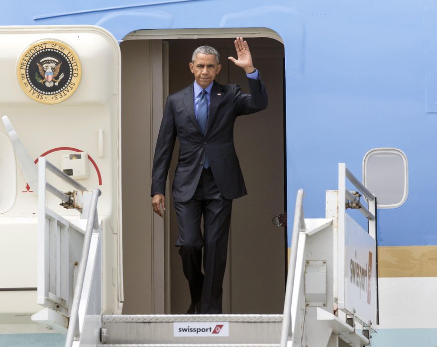 President Barack Obama steps out of Air Force One at Los Angeles International airport on Thursday, June 18, 2015. (AP Photo/Damian Dovarganes)