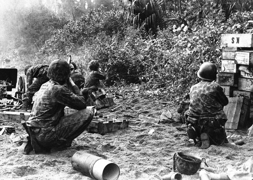 In this Jan. 30, 1944, image provided by the U.S. Marine Corps, U.S. Mariner Raiders capture a Japanese stronghold at Bougainville in the Solomon Islands. From now on, an elite branch of the U.S. Marine Corps will officially be known as Raiders, similar to names like Army Green Berets and Navy SEALs. The Marines will rename several special operations units Marine Raiders at a ceremony on Friday, June 19, 2015. The move resurrects a moniker used by famous World War II units that carried out risky amphibious and guerrilla operations. (AP Photo/U.S. Marine Corps, File)