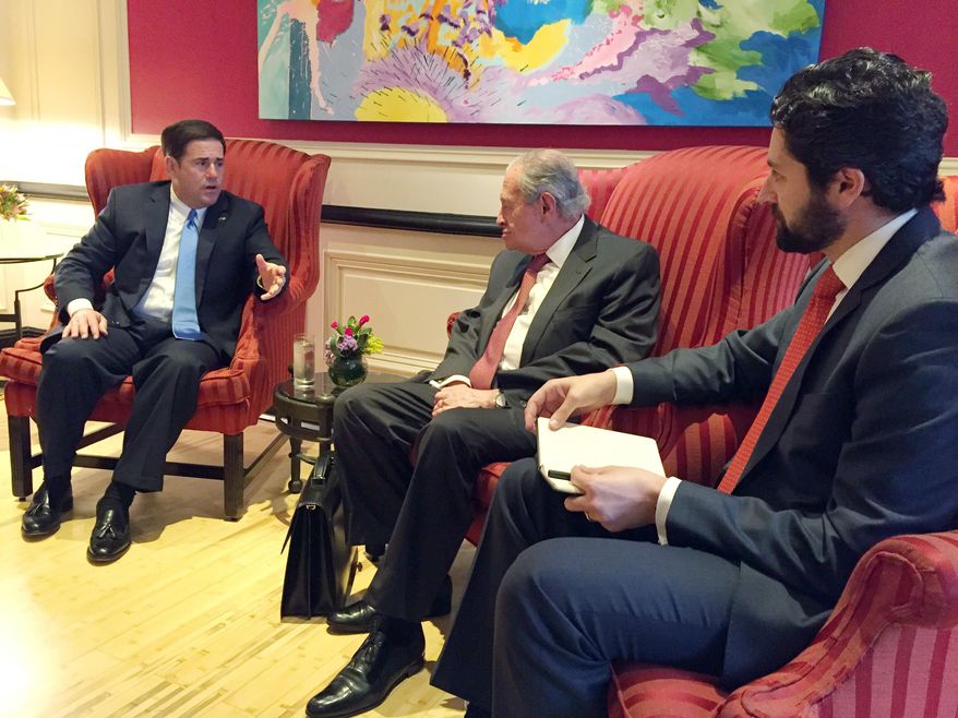 In this June 17, 2015 photo provided by the Office of Governor Doug Ducey, the Arizona governor, left meets with Xavier Garcia de Quebedo, President of Grupo Mexico, center, and Fernando Lopez Guerra, President of Ferromex, right, during Ducey's visit to Mexico City. It was Ducey's first trip to Mexico since his inauguration in January, and appeared at least in part designed to repair relations with the state’s southern neighbor that were damaged by former Gov. Jan Brewer’s positions on immigration.(Office of Governor Doug Ducey, via AP)