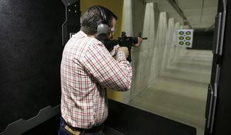 Republican presidential candidate, Sen. Ted Cruz, R-Texas, shoots a Smith &amp; Wesson M&amp;P15 at the CrossRoads Shooting Sports, Saturday, June 20, 2015, in Johnston, Iowa. (AP Photo/Charlie Neibergall)