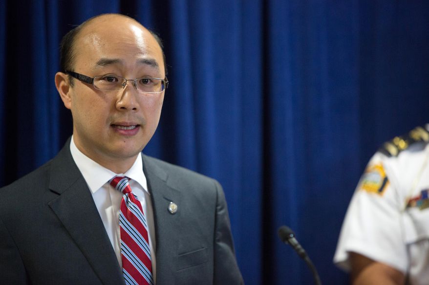 FILE - In a Friday, June 5, 2015 file photo, Ramsey County Attorney John Choi announces criminal charges against the Archdiocese of Saint Paul and Minneapolis during a news conference in St. Paul. Prosecutors charged the archdiocese as a corporation with six gross misdemeanor counts alleging that it failed to protect children. No individual church leaders were charged. (Jennifer Simonson/Minnesota Public Radio via AP, File)