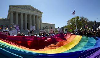 In this April 28, 2015, file photo, demonstrators stand in front of a rainbow flag of the Supreme Court in Washington, as the court was set to hear historic arguments in cases that could make same-sex marriage the law of the land. Gay and lesbian couples could face legal chaos if the Supreme Court rules against same-sex marriage in the next few weeks. Same-sex weddings could come to a halt in many states, depending on a confusing mix of lower-court decisions and the sometimes-contradictory views of state and local officials. Among the 36 states in which same-sex couples can now marry are 20 in which federal judges invoked the Constitution to strike down marriage bans. (AP Photo/Jose Luis Magana, File)