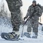 In this Dec. 6, 2012, photo provided by the U.S. Department of Defense, soldiers assigned to 6th Engineer Battalion use snow shoes during Arctic Light Individual Training on the Bulldog Trail in sub-zero conditions at Joint Base Elmendorf-Richardson, Alaska. ALIT is the United States Army Alaska&#39;s Cold Weather Indoctrination program. It gives all soldiers, regardless of their job, the foundation to successfully work, train, and go to war in some of the harshest environments in the world. (AP Photo/U.S. Air Force, Justin Connaher) **FILE**