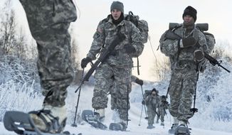 In this Dec. 6, 2012, photo provided by the U.S. Department of Defense, soldiers assigned to 6th Engineer Battalion use snow shoes during Arctic Light Individual Training on the Bulldog Trail in sub-zero conditions at Joint Base Elmendorf-Richardson, Alaska. ALIT is the United States Army Alaska&#39;s Cold Weather Indoctrination program. It gives all soldiers, regardless of their job, the foundation to successfully work, train, and go to war in some of the harshest environments in the world. (AP Photo/U.S. Air Force, Justin Connaher) **FILE**