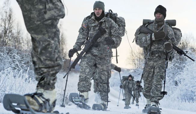 In this Dec. 6, 2012, photo provided by the U.S. Department of Defense, soldiers assigned to 6th Engineer Battalion use snow shoes during Arctic Light Individual Training on the Bulldog Trail in sub-zero conditions at Joint Base Elmendorf-Richardson, Alaska. ALIT is the United States Army Alaska&#x27;s Cold Weather Indoctrination program. It gives all soldiers, regardless of their job, the foundation to successfully work, train, and go to war in some of the harshest environments in the world. (AP Photo/U.S. Air Force, Justin Connaher) **FILE**