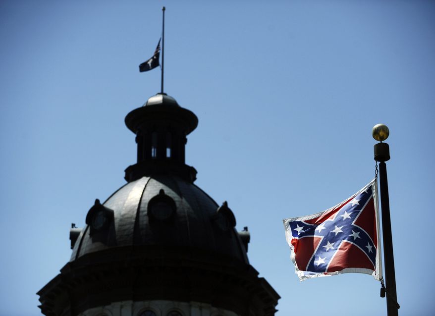 A Confederate flag flies near the South Carolina Statehouse in Columbia, South Carolina. (AP Photo/Rainier Ehrhardt)