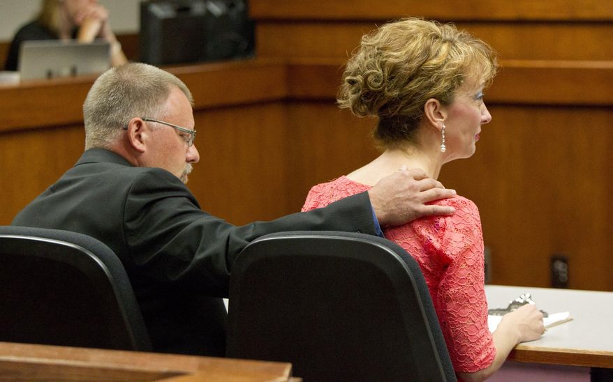 Kassandra Keyzer's mother, Karen Louwenaar, gives a victim statement during the sentencing of a 16-year-old boy at Allegan County Circuit Court Monday, June 22, 2015, in Allegen, Mich. The teen was sentenced 40-60 years in prison for raping and killing Kassandra Keyzer. (Cory Morse/The Grand Rapids Press via AP) ALL LOCAL TELEVISION OUT; LOCAL TELEVISION INTERNET OUT