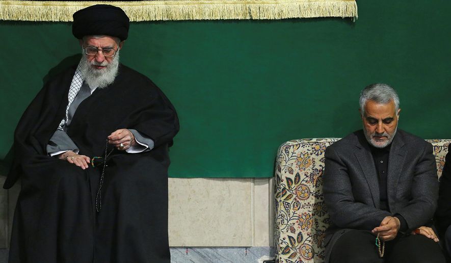 In this photo released by an official website of the office of the Iranian supreme leader, commander of Iran&#39;s Quds Force, Qassem Soleimani, right, sits next to the Supreme Leader Ayatollah Ali Khamenei while attending a religious ceremony in a mosque at his residence in Tehran, Iran, Friday, March 27, 2015. (AP Photo/Office of the Iranian Supreme Leader)