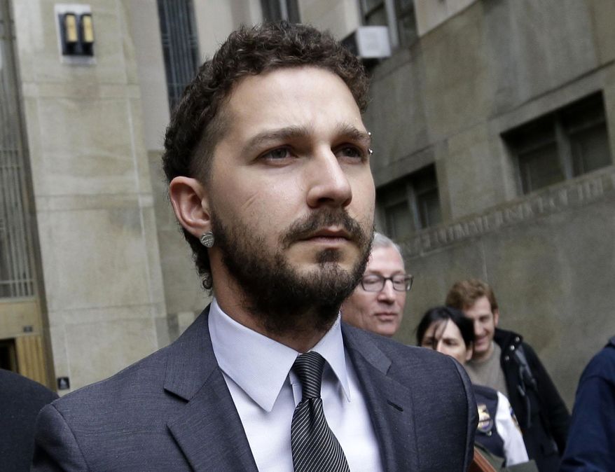 FILE - In this March 20, 2015 file photo, actor Shia LaBeouf is escorted by court officers as he leaves Manhattan Criminal court in New York. LaBeouf has received stitches to his head and hand after suffering an injury on the North Dakota set of the film “American Honey.” A publicist for LaBeouf said on Wednesday, June 24, the actor’s injuries were “minimal.” The accident occurred Tuesday evening for a scene in which the actor was to put his head through a glass window. LaBeouf was treated at a local hospital for a laceration to his head and hand. He’s to return to shooting Thursday. (AP Photo/Mary Altaffer, File )