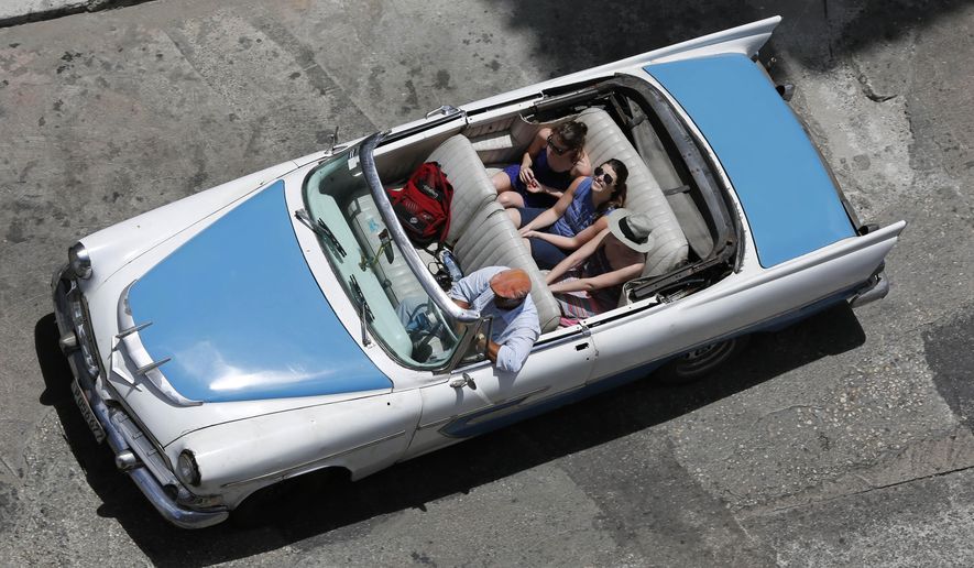 FILE - In this May 13, 2015, file photo, tourists ride a classic American convertible in Havana, Cuba. Caribbean tourism officials are pushing for a partnership with the U.S. government because of concerns that warming relations between the U.S. and Cuba will result in a significant loss of visitors to the rest of the region. Cuba has seen such a surge in visitors that the fragile budgets of many tourism-dependent islands will be hit hard if they don&#39;t take action, Frank Comito, CEO of the Caribbean Hotel &amp;amp; Tourism Association, said Wednesday, June 24, 2015. (AP Photo/Desmond Boylan, File)