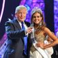FILE - In this June 16, 2013 file photo, Donald Trump, left, and Miss Connecticut USA Erin Brady pose onstage after Brady won the 2013 Miss USA pageant in Las Vegas, Nev. Univision says it is dropping the Miss USA Pageant and says it will cut all business ties with Donald Trump over comments he made about Mexican immigrants. The network said Thursday, June 25, 2015, it will not air the pageant on July 12, as previously scheduled, and has ended its business relationship with the Miss Universe Organization due to what it called &amp;quot;insulting remarks about Mexican immigrants&amp;quot; by Trump, a part owner. (AP Photo/Jeff Bottari, File)