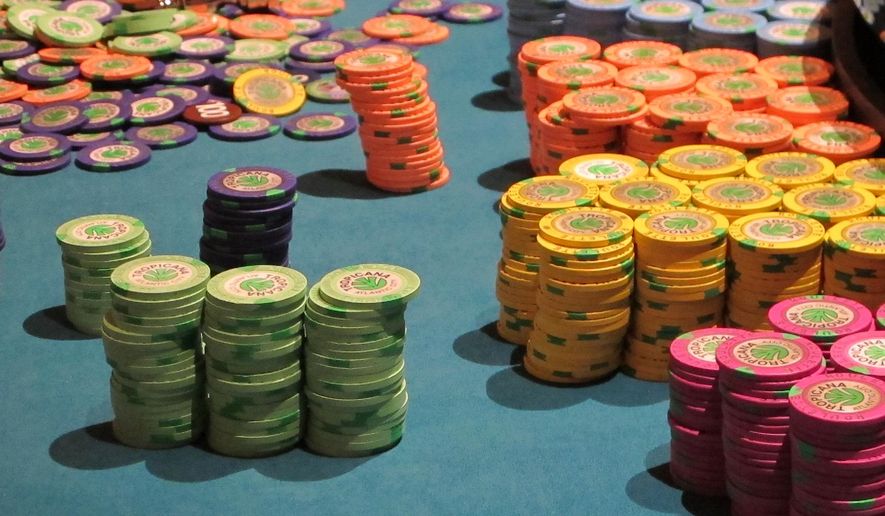 This April 17, 2015 photo shows stacks of gambling chips on a roulette table at the Tropicana Casino and Resort in Atlantic City N.J. A package of five bills to assist Atlantic City and its struggling casinos was to be voted upon by the New Jersey Legislature on Thursday June 25, 2015. The most significant of them would allow casinos to make payments in lieu of taxes for 15 years. (AP Photo/Wayne Parry)