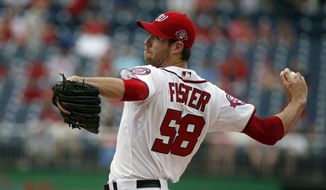 Washington Nationals starting pitcher Doug Fister throws during the first inning of a baseball game against the Atlanta Braves at Nationals Park, Thursday, June 25, 2015, in Washington. (AP Photo/Alex Brandon)
