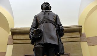 A statue of Robert E. Lee is on display on Capitol Hill in Washington, Wednesday, June 24, 2015.  The statue was given to the National Statuary Hall Collection by Virginia in 1909. Lee served as a commander in the Confederate Army during the Civil War. The move in South Carolina to remove the Confederate flag from the statehouse grounds is prompting members of Congress to take a new look at Confederate images that surround them every day. (AP Photo/Susan Walsh)