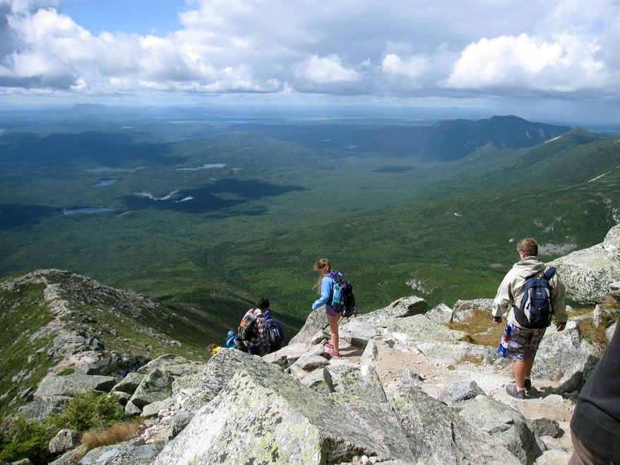 Hikers make their way down the Appalachian's Mount Katahdin in Baxter State Park in Maine. The mountain is nearly a mile high and is the tallest mountain in Maine. Its peak is the northern terminus of the Appalachian Trail. (AP Photo/Beth J. Harpaz/File)