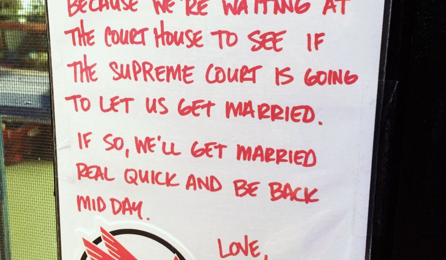 This handout photo provided by Kenneth Denson shows a sign he posted and photographed outside his business on Thursday, June 25, 2015 in Dallas. On Friday, June 26, 2015, the Supreme Court declared Friday that same-sex couples have a right to marry anywhere in the United States, a historic culmination of two decades of litigation over gay marriage and gay rights generally. (Kenneth Denson, via AP)