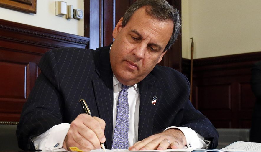 New Jersey Gov. Chris Christie signs the state's 2016 budget, Friday, June 26, 2015, in Trenton, N.J. Christie vetoed more than $1.6 billion from the 2016 budget approved by the Democratic-controlled Legislature and signed a roughly $34 billion budget into law. (AP Photo/Julio Cortez)