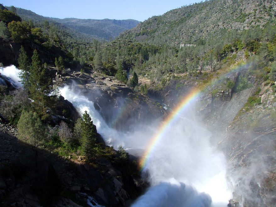 FILE - This May, 16, 2012 file photo shows a rainbow forming in the mist from water releases at Hetch Hetchy Reservoir on the Tuolomne River in Yosemite National Park, Calif. On Friday, June 26, 2015, regulators told San Francisco to stop taking some of the river water it routinely stores in the Hetch Hetchy reservoir — though it wasn't immediately clear what the practical effect would be. (John Holland/The Modesto Bee via AP, File)