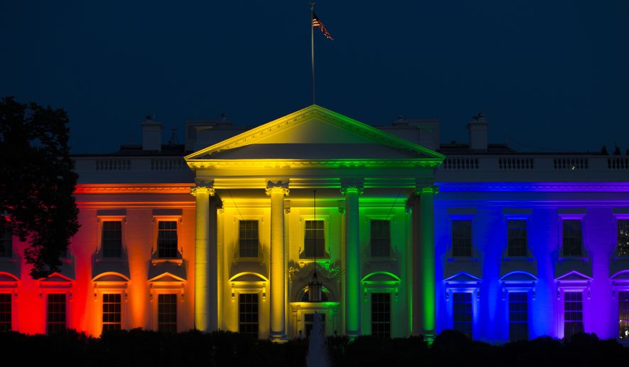 The White House is lit up in rainbow colors in commemoration of the Supreme Court&#39;s ruling to legalize same-sex marriage on Friday, June 26, 2015, in Washington. (AP Photo/Evan Vucci)