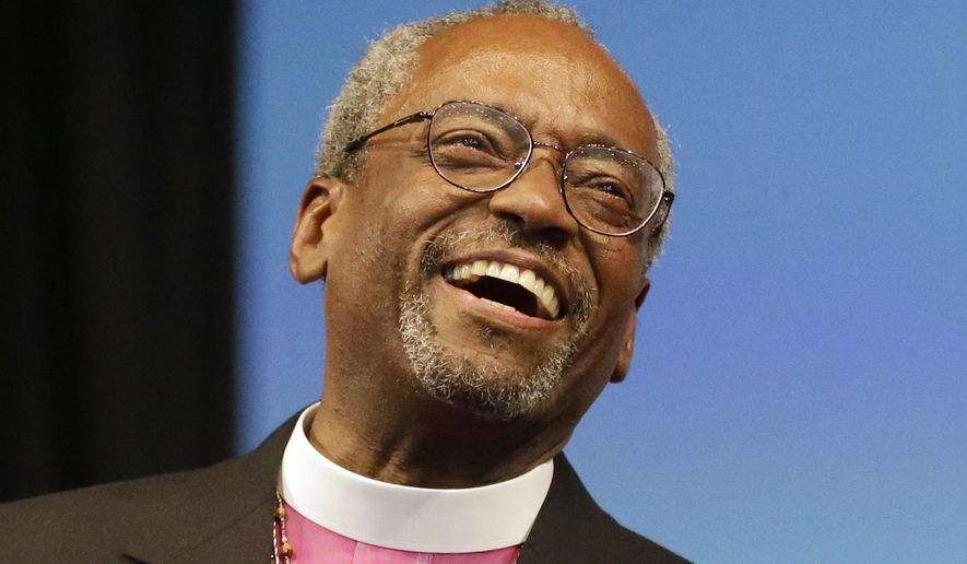 Bishop Michael Curry of North Carolina, smiles after being elected the Episcopal Church&#39;s first African-American presiding bishop at the Episcopal General Convention Saturday, June 27, 2015, in Salt Lake City. Curry won the vote in a landslide. (AP Photo/Rick Bowmer)