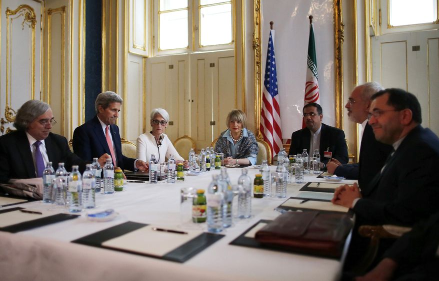From left, U.S. Secretary of Energy Ernest Moniz, U.S. Secretary of State John Kerry and U.S. Under Secretary for Political Affairs Wendy Sherman meet with Iranian Foreign Minister Mohammad Javad Zarif, second from right, at a hotel in Vienna, Austria, Saturday, June 27, 2015. After nearly a decade of international diplomacy, negotiators are trying to reach a final agreement by Tuesday that would curb Iran's nuclear activities for a decade and put tens of billions of dollars back into the Iranian economy through the easing of financial sanctions. (Carlos Barria/Pool Photo via AP)