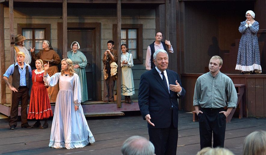 ADVANCE FOR MONDAY JUNE 29 AND THEREAFTER This Friday, June 19, 2015 shows U.S. District Judge Joseph Goodwin, center right, made a cameo appearance in the play “Honey in the Rock” at the Cliffside Amphitheatre in Grandview, W.Va. He later described how 51 years ago he came on stage and introduced himself as the character David Morgan, and how the experience affected his life. (Craig Cunningham/Charleston Daily Mail via AP)