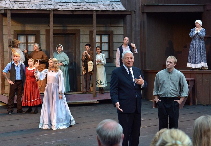 ADVANCE FOR MONDAY JUNE 29 AND THEREAFTER This Friday, June 19, 2015 shows U.S. District Judge Joseph Goodwin, center right, made a cameo appearance in the play “Honey in the Rock” at the Cliffside Amphitheatre in Grandview, W.Va. He later described how 51 years ago he came on stage and introduced himself as the character David Morgan, and how the experience affected his life. (Craig Cunningham/Charleston Daily Mail via AP)