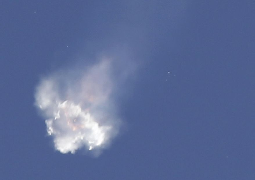 The SpaceX Falcon 9 rocket and Dragon spacecraft breaks apart shortly after liftoff at the Cape Canaveral Air Force Station in Cape Canaveral, Fla., Sunday, June 28, 2015. The rocket was carrying supplies to the International Space Station. (AP Photo/John Raoux)