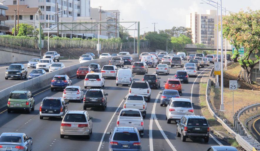 In this Friday, June 26, 2015 photo, drivers head into downtown Honolulu from the island's West side. On an island that many people think of as paradise, the struggle to get to school or to work in crushing traffic gridlock is a daily part of life. The amount of time it takes Oahu commuters to get to work is higher than the national average. (AP Photo/Cathy Bussewitz)