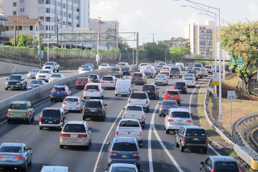 In this Friday, June 26, 2015 photo, drivers head into downtown Honolulu from the island's West side. On an island that many people think of as paradise, the struggle to get to school or to work in crushing traffic gridlock is a daily part of life. The amount of time it takes Oahu commuters to get to work is higher than the national average. (AP Photo/Cathy Bussewitz)