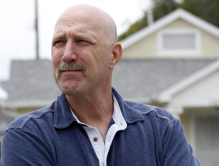 In this Thursday, June 4, 2015 photo, David Klinger, professor of criminology and criminal justice at the University of Missouri-St. Louis, stands in a neighborhood in south-central Los Angeles where he used to work as a police officer. Although he'd never been in a fight in school or afterward _ "I always have viewed trying to talk to people and reason with people as the best way to resolve things" _ Klinger concluded he could kill, if it meant he'd be saving the life of a fellow officer or innocent civilian. He would heed his training at the academy: "You only shoot if you absolutely have to." (AP Photo/Martha Irvine)