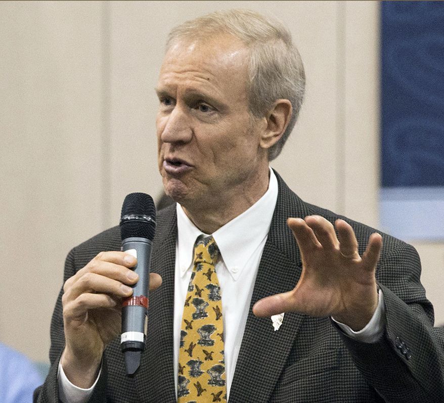 FILE - In this May 1, 2015, file photo, Illinois Gov. Bruce Rauner speaks to members of the Greater Belleville Chamber of Commerce in Belleville, Ill. Republican Gov. Rauner’s call for business-climate changes includes some small print. Democrats have read it and say it’s extreme. The new governor has said he want negotiate a balanced budget with Democrats in the Legislature until he gets these changes to lower business costs and crimp political corruption. The fiscal year begins Wednesday, July 1, 2015 and without a spending plan, services could be disrupted. (Derik Holtmann/Belleville News-Democrat, via AP, File)