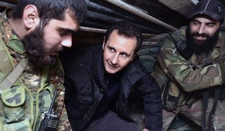 Syrian President Bashar Assad visits troops on the front line in Damascus. Officials said several jihadi factions, including the ruthless Islamic State, are gaining ground quickly against the regime&#x27;s fighters in several parts of the nation. (Associated Press)