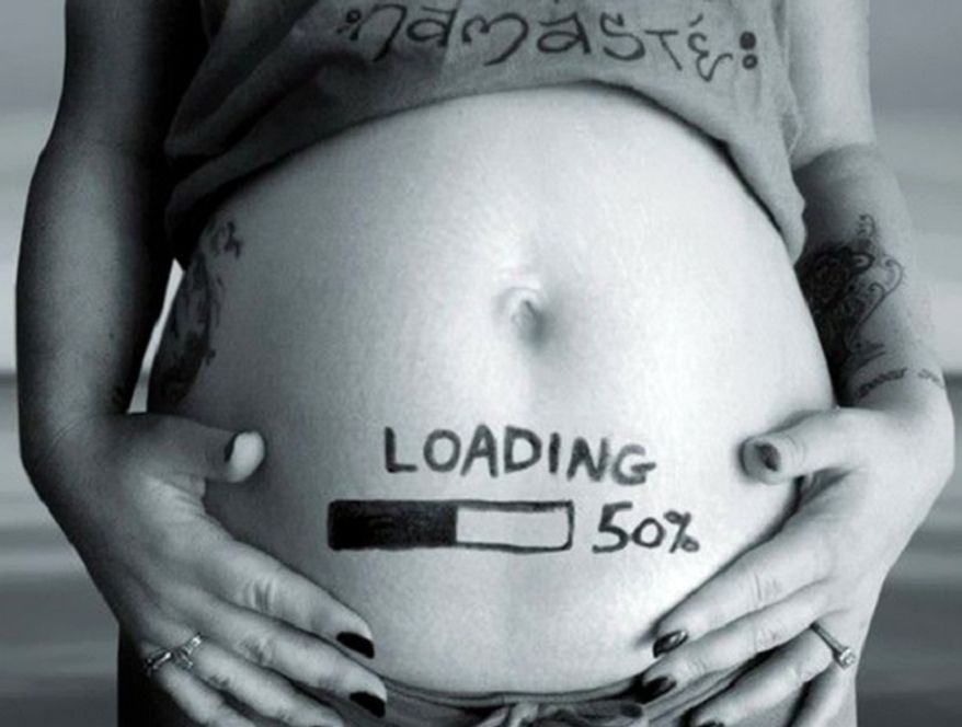 Tech Friendly Announcement: No spinning beach ball here! Just a growing bundle of joy.
(Photo: Boredpanda.com)