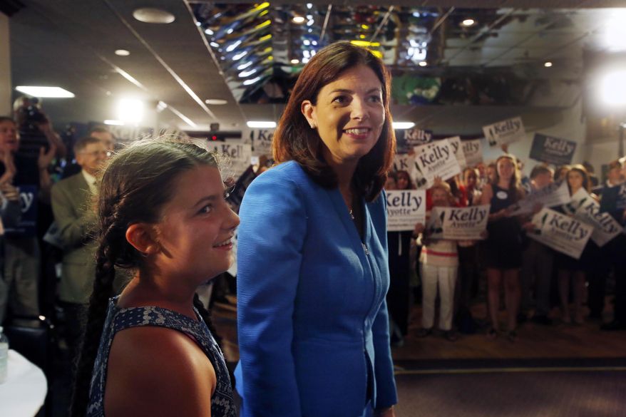 Sen. Kelly Ayotte, R-N.H., arrives with her daughter Katherine where she announced her plans to seek a second term in the U.S. Senate Tuesday, June 30, 2015, in Manchester, N.H. (AP Photo/Jim Cole)