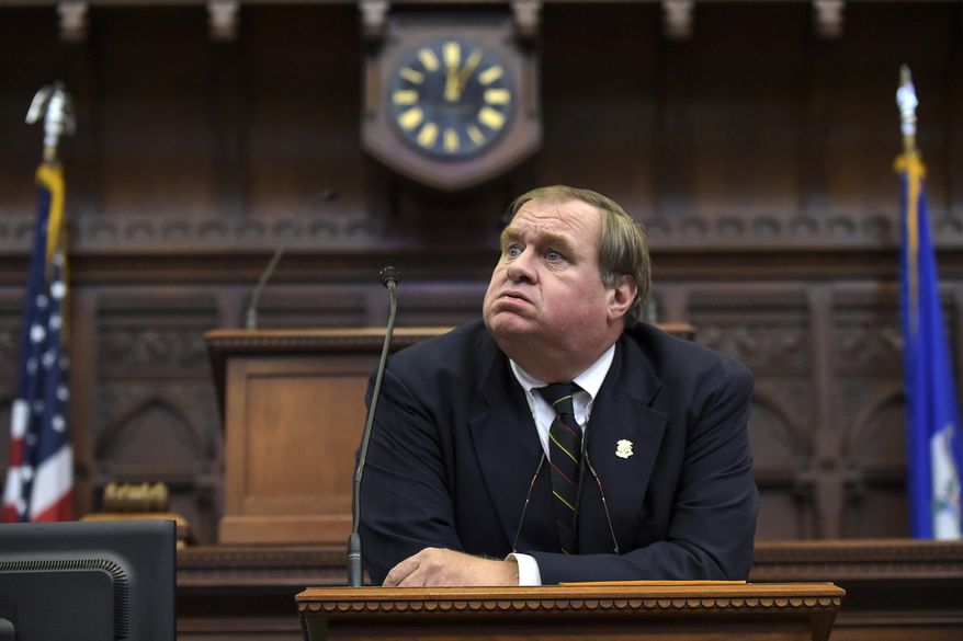 Martin J. Dunleavy, clerk of the House of Representatives, sighs during the delayed start of the Connecticut legislature&#x27;s special session on Monday, June 29, 2015, in Hartford, Conn. Both the House and Senate will vote on the state budget as well as criminal justice bills. (Patrick Raycraft/The Hartford Courant via AP) MANDATORY CREDIT