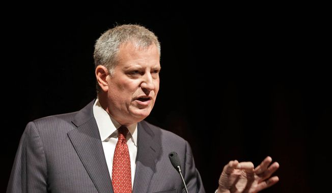 New York City Mayor Bill de Blasio speaks to the graduates of the Boys and Girls High School in New York in this June 25, 2015, file photo. (AP Photo/Seth Wenig, File)