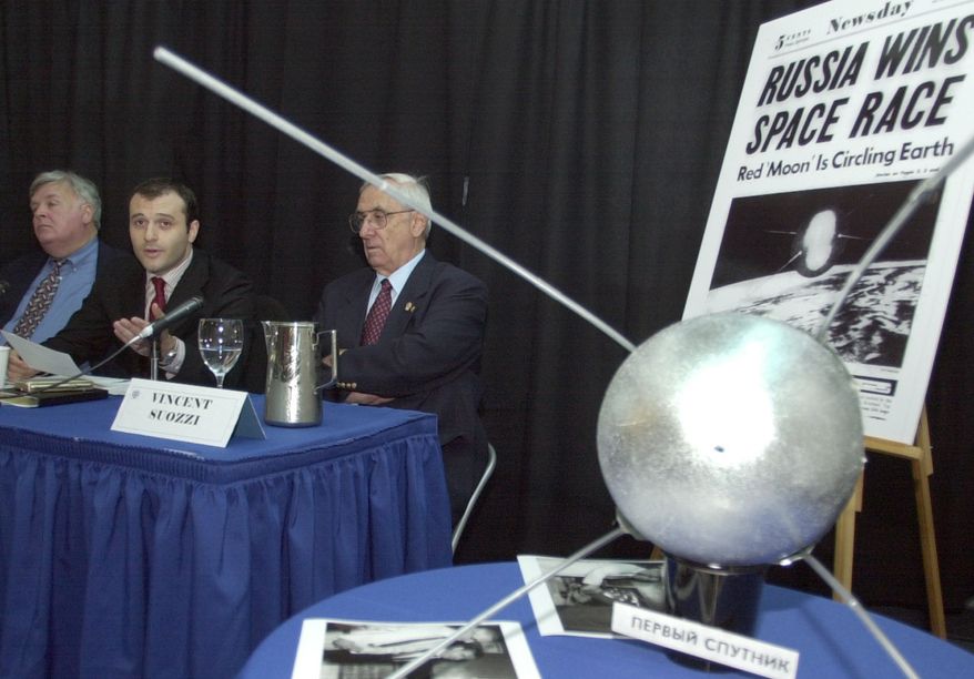 The Russian Vice Consul to New York, Vage Engibarian, second left, speaks at the Cradle of Aviation Museum in Garden City, NY, Friday, Oct. 4, 2002. The museum commemorated the 45th anniversary of the launch of Sputnik. Looking on left is Paul Dickson, author of &quot;Sputnik, The Shock of the Century&quot;, and Vincent Suozzi, right, former mayor of Glen Cove, NY. A model of Sputnik is in the foreground. (AP Photo/Ed Bailey)